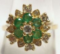 A hallmarked Gold six small Emerald and twelve small brilliant cut Diamond Ring (marks incomplete)