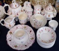 A 19th Century Pink Lustre Composite Tea Service, comprises Teapot, two-handled Covered Sugar