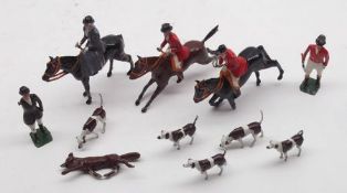 A small tin containing Britains Horse and Hounds Painted Lead Figures (condition varies)