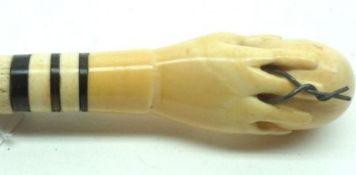 A Vintage Ivory Cane with detachable screw-off handle formed as a hand clutching a ball, 31” long