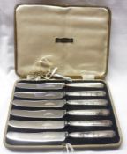 A Cased Set of six Stainless Bladed and Silver-handled Cake Knives (A/F)