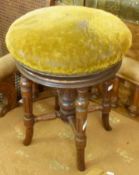 A Victorian Rosewood Circular Adjustable Piano Stool, raised on reeded and ring-turned supports,