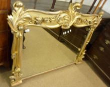 A 19th Century Giltwood and Gesso Framed Overmantel Mirror of shaped rectangular form, with heavy