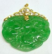A mid-late 20th Century Carved Jadeite Pendant of shaped oval form, having unmarked yellow metal