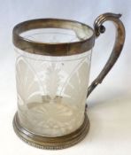 A Victorian Frosted Glass Tankard (glass cracked), having a Victorian Silver Handle and Mounts, 5 ¼”