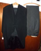 A 1940s Gents Black Wool Tail Suit, by Pioneer Baghdad, Special Appointment to HRH The Regent,