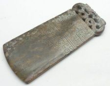 A Soapstone Tablet with “S” scroll handle and the body embossed with designs etc, 6 ¾” long