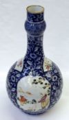 A Chinese decorative Spill Vase, painted in colours with panels of Mandarin Figures and sprigs of