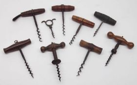 A Mixed Lot of various late 19th/early 20th Century Treen-handled Corkscrews, mainly with treen