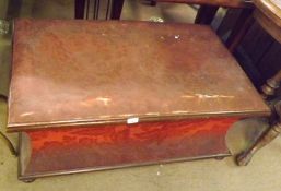 A Victorian Mahogany Framed Ottoman of waisted rectangular form, with plain interior on compressed