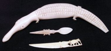 An African Bone or Ivory Tusk carved in the form of a Crocodile or Alligator; a further small Knife,