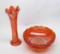 A Carnival Glass Spill Vase and a further circular Bowl with facetted panels and star cut base,