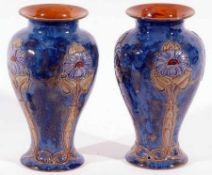 A pair of Royal Doulton Stoneware Baluster Vases, moulded, tube-lined and decorated with Art Nouveau
