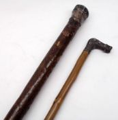 A Walking Cane with hallmarked Silver button handle (crushed); and a further white metal handled