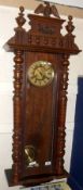 A last quarter of the 19th Century Vienna Style Wall Clock, with stained wood case, circular dial