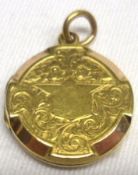 A hallmarked 15ct Gold Circular Locket, with foliate engraved decoration to back and front, also