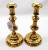 A pair of late 19th Century Brass Candlesticks, of typical baluster form on spreading circular