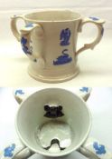 A Staffordshire Four-Handled Loving Cup inset with two black frogs, the outer body moulded in blue