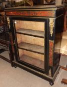A 19th Century Ebonised and Red Boulle Pier Cabinet, with plain top with gilded beaded edge, and the