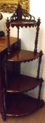 A 19th Century Mahogany Four Tier Bow Fronted Whatnot, with twisted column supports, 23” wide