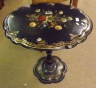 A 19th Century Lacquered Pedestal Table of oval form, the top painted and decorated in the Shibayama