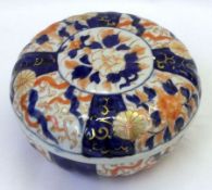 A Japanese Imari circular covered Powder Bowl, typically painted in traditional colours with a