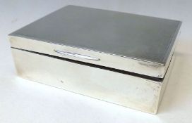 An Elizabeth II Silver encased Cigarette Box or rectangular form, with plain engine turned lid,