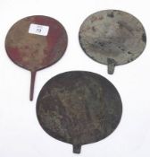 An Oriental small circular Face Screen and two other base Metal examples with missing handles, (3)