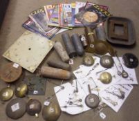 A box of assorted Clock Parts mainly weights plus a small quantity of Clock Magazines