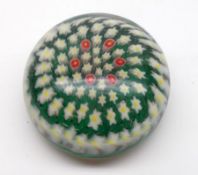 A 20th Century Paperweight with radiating foliate design on a predominantly green ground, 3 ¾”