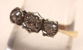 A high grade yellow metal Ring, set with three small old cut Diamonds, stamped “18ct & plat”