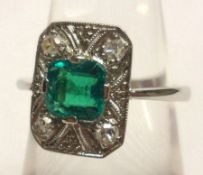 An art deco period precious metal Dress Ring, a shaped rectangular panel featuring a faceted