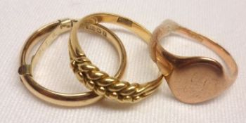 A group comprising:  a high grade precious metal braided front Ring, stamped “18ct”, weighing