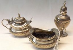 An Edwardian three piece Condiment Set, oval shaped with half fluted decoration comprising: