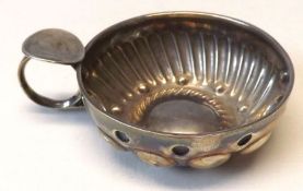 A French white metal Wine Taster of usual form, embossed and fluted decoration, plain round thumb