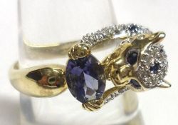 An interesting hallmarked 9ct Gold Panther design Ring, the panther inlaid with small Diamonds and
