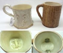 An unusual Frog Mug, the outer body embossed with Archers and Sportsmen with gilded detail, and