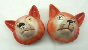 Two Staffordshire Stirrup Cups modelled as Foxes Heads, the faces each with naturalistic detail