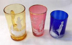 An Amber Glass Tankard, a further Cranberry Beaker and a blue glass small Tankard with clear handle,