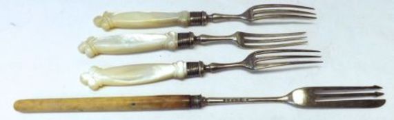 A Packet of three Edward VII Dessert Forks with carved Mother of Pearl handles, Sheffield 1905;
