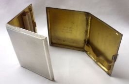 A rare pair of engine turned rectangular Cigarette Cases, with canted edges, gilt interiors,
