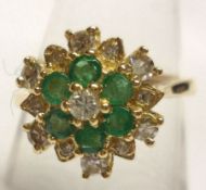 A hallmarked Gold six small Emerald and twelve small brilliant cut Diamond Ring (marks incomplete)