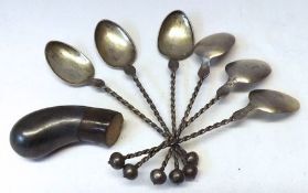 A Packet containing six Oriental white metal Coffee Spoons with twist stems and ball finials, makers