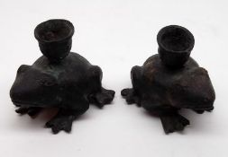 A pair of unusual Bronze Patinated Novelty Candlesticks, the supports modelled as crouching frogs,