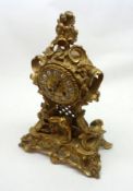 A 3rd quarter of the 19th Century French Ormolu Mantel Clock in Rococo taste, the base featuring a