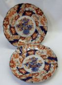 A pair of Imari small circular Plates, typically decorated in traditional colours and the backs