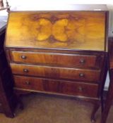 A Reproduction Walnut Effect Bureau, with fall front and fitted interior, over three drawers on