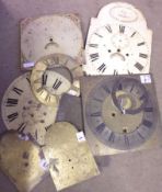 A collection of seven assorted Antique Brass and Painted Clock Faces