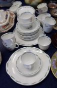 A Susie Cooper Bone China Tea Service, decorated with the “Fragrance” pattern, comprises ten Cups