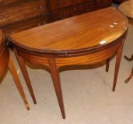 An early 19th Century Satinwood and Mahogany Crossbanded Demi-Lune Fold Top Card Table, inlaid